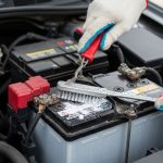 Cleaning car battery terminals with a brush