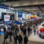 Crowds of visitors exploring car exhibits inside the Los Angeles Convention Center at the 2026 LA Auto Show