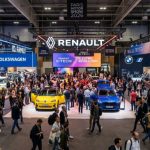 Crowds of car enthusiasts exploring electric vehicle stands from Volkswagen, Renault, and BMW at the Paris Motor Show 2026 inside Paris Expo Porte de Versailles