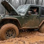 Phoenix off road vehicle climbing a rocky desert trail