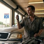 Mechanic diagnosing poor engine tuning in Houston