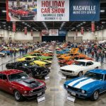 Rows of gleaming classic American muscle cars including Mustangs and Camaros on display inside an indoor exhibition hall at the Holiday Classic Car Show Nashville 2026 in December