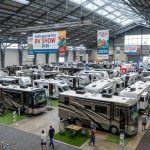 Rows of motorhomes and travel trailers on display at the Portland Metro RV Show 2026 inside the Portland Exposition Center